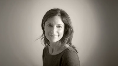 Headshot of Amy Vitale in sepia.