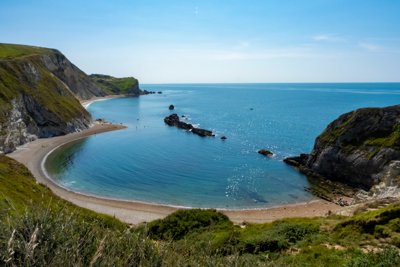 A view over Lulworth Cove in sunshine