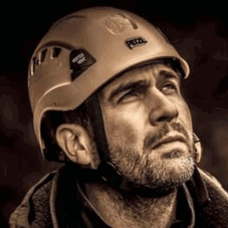Close up phtoo of James Dyer wearing a helmet. 