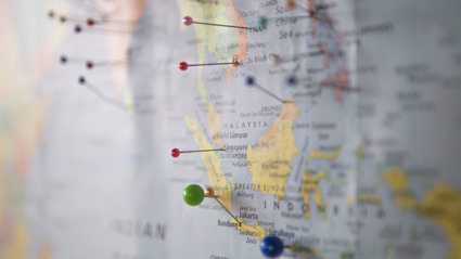 Map close-up of Indonesia and Malaysia with pins stuck in different places.