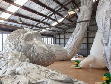 Art installation of inflatable silver gorilla.