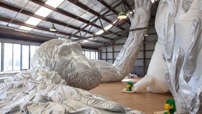 Art installation of inflatable silver gorilla.