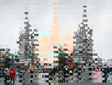 People walking on the street near Saint Basil's Cathedral. Church in Red Square in Moscow, Russia 