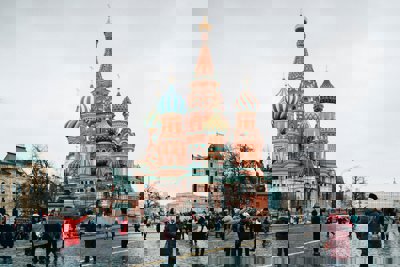 People walking on the street near Saint Basil's Cathedral. Church in Red Square in Moscow, Russia 