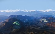 Photograph of mountains with shadows of artwork overlain on mountains.