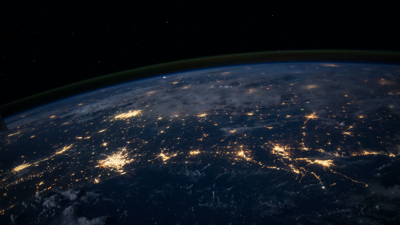 A zoomed in sataliite veiw of the Gulf of mexico, with a view of Earth's atmosphere and stars in the distance.