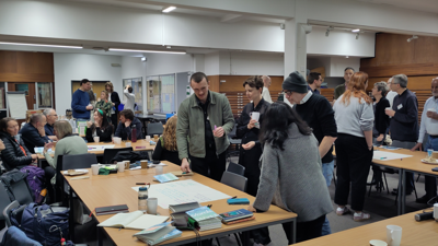 Attendees at the anniversary celebration socialise and participate in workshops