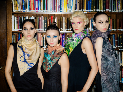 Four models wearing brightly-coloured scarves from the Tammam and European Space Agency collection.