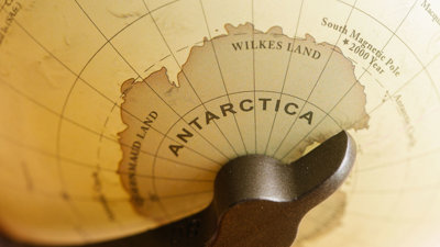 Sepia coloured globe focussing on Antarctica.