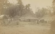 An early photographic image showing people in a village