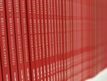 Shelf stacked with geographical journals 