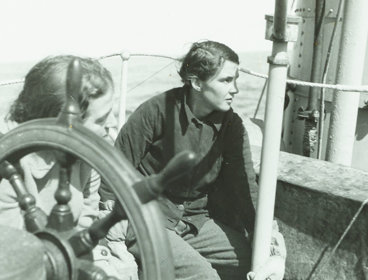 Two members of the British East Greenland Expedition 1935-1936 aboard a boat.