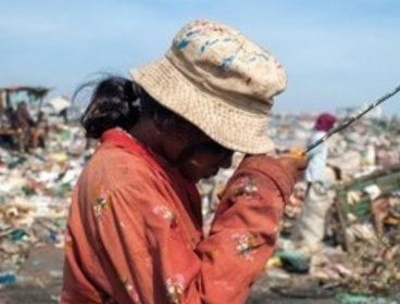 Person at a waste disposal .
