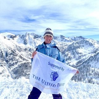 Polly Marsh with The Ulysses Trust banner.