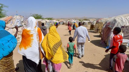 OCVP researchers and locals on a walk at Camp A