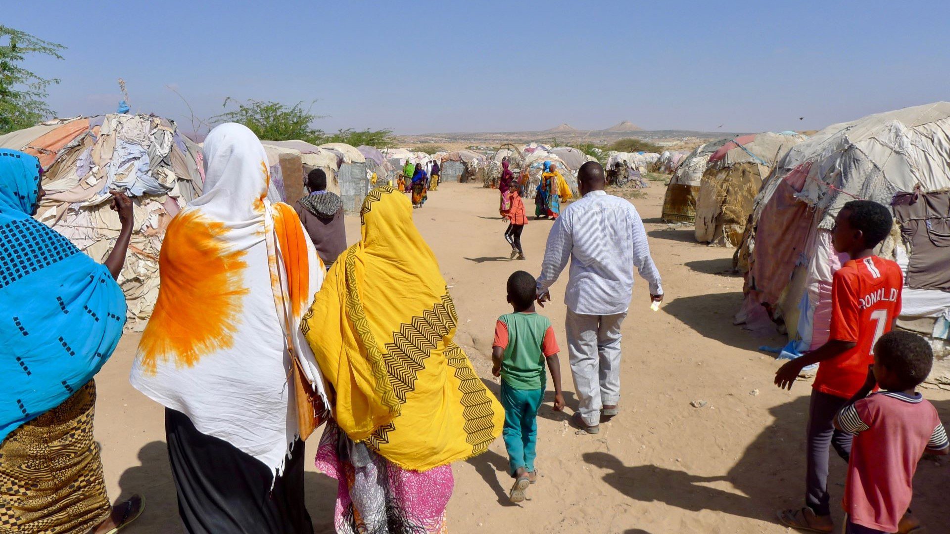 OCVP researchers and locals on a walk at Camp A