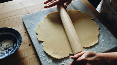 Person rolling out pastry