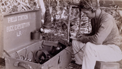 Person using radio equipment on Alexander Hamilton Rice’s final expedition to Amazonia.