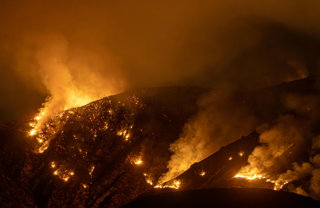 Fire On Hillside At Night
