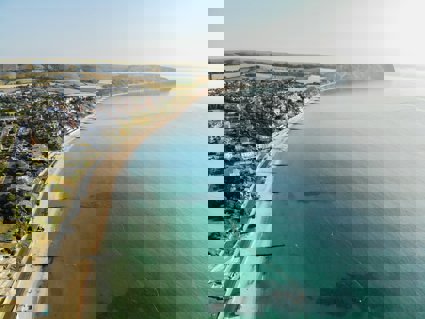 A bay from above showing groynes and a sandy beach