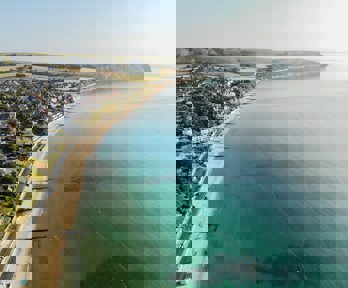 A bay from above showing groynes and a sandy beach